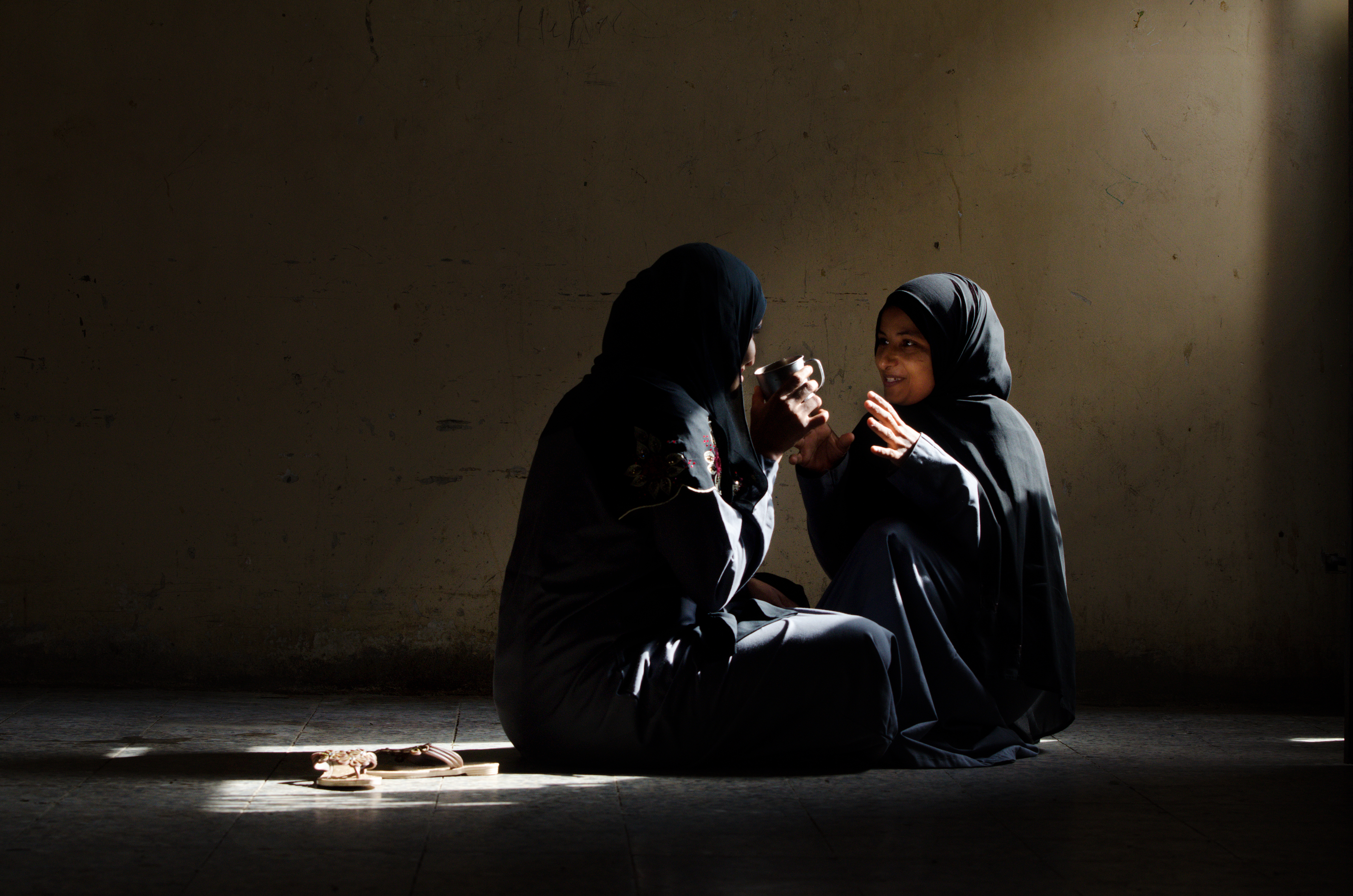 Young women in Hodeidah prison: Mariam, 19 years old, (right), talking to her friend Hafsah, age 27. Photo credit: © Amira Al-Sharif/Progressio Young women in Hodeidah prison: Mariam, 19 years old, (right), talking to her friend Hafsah, age 27. Photo credit: © Amira Al-Sharif/Progressio