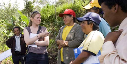Jo Barett interviews a group of Andean farmers