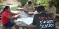 Time for Climate Justice campaigners sit around the table