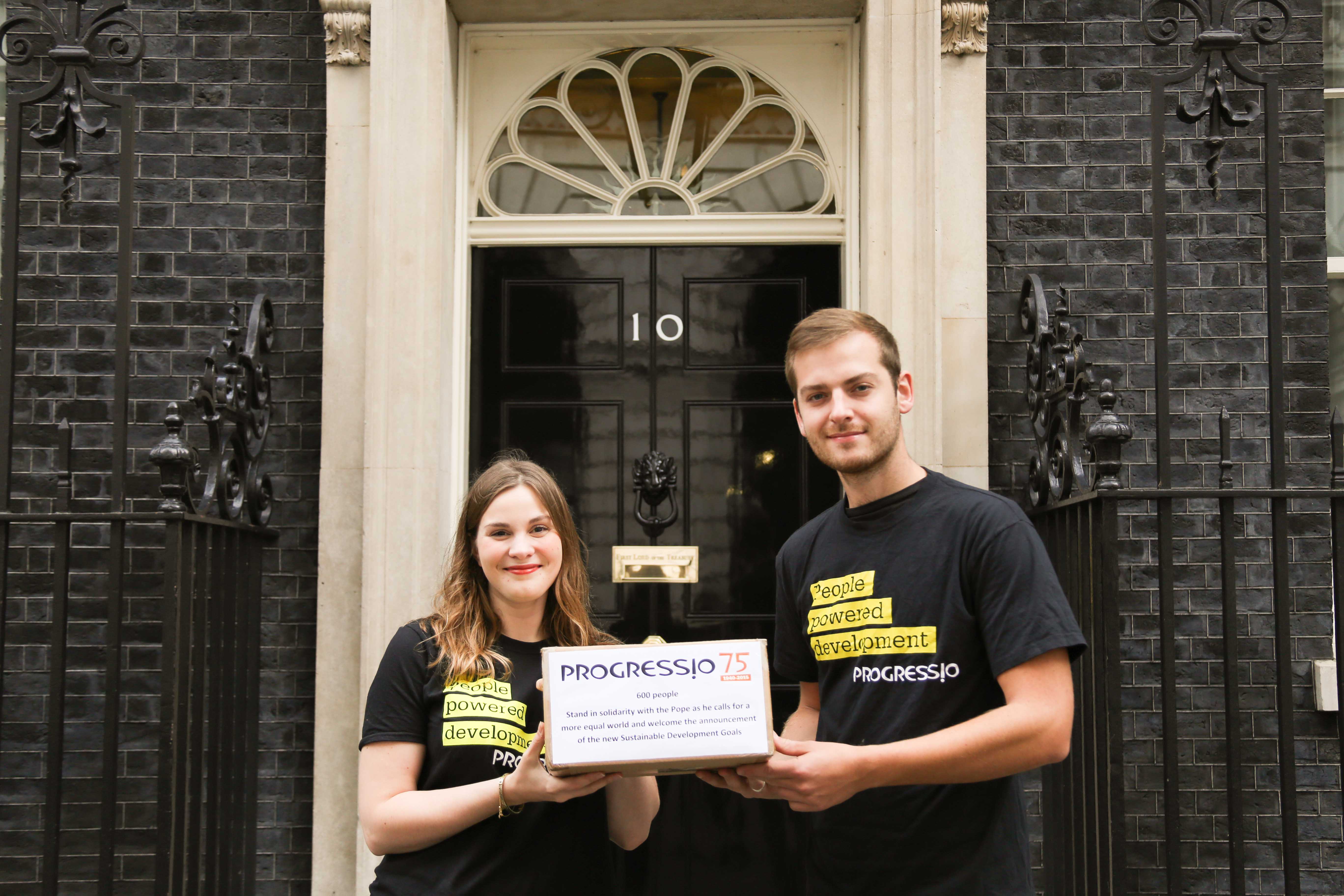 Campaigns Officer Jenny Vaughan and Action at Home Officer Seb Scott hand in petition to No 10 Campaigns Officer Jenny Vaughan and Action at Home Officer Seb Scott hand in petition to No 10
