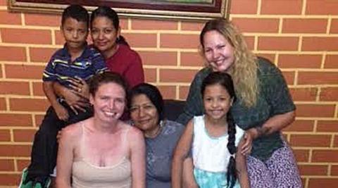 Olivia and Lisa with their host family Olivia and Lisa with their host family