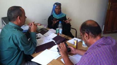 Sarah Kamya at a meeting with colleagues