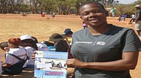 Holding a sample of books we were distributing during the Y.E.S League Holding a sample of books we were distributing during the Y.E.S League